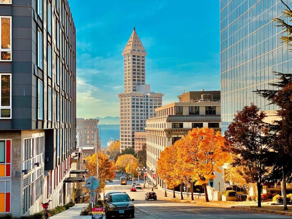 Vibrant commercial district featuring modern office buildings and colorful autumn trees in Seattle.