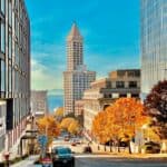 Vibrant commercial district featuring modern office buildings and colorful autumn trees in Seattle.